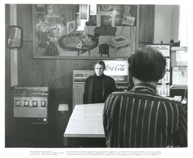 Frank Bullitt in hotel foyer.